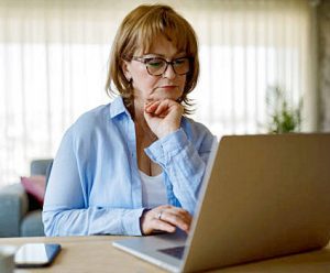 signs and symptoms research on laptop